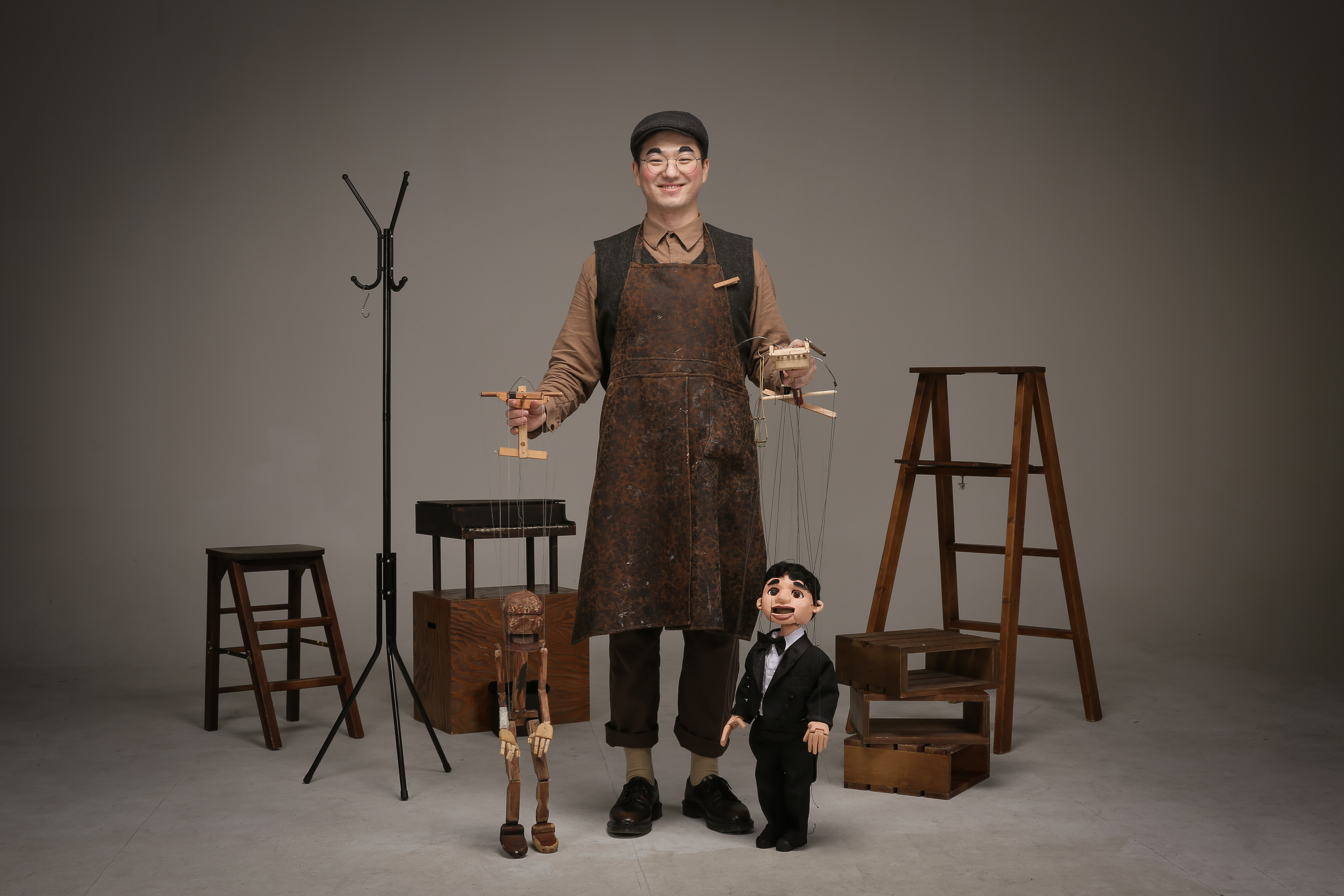 A Young Carpenter with Marionette